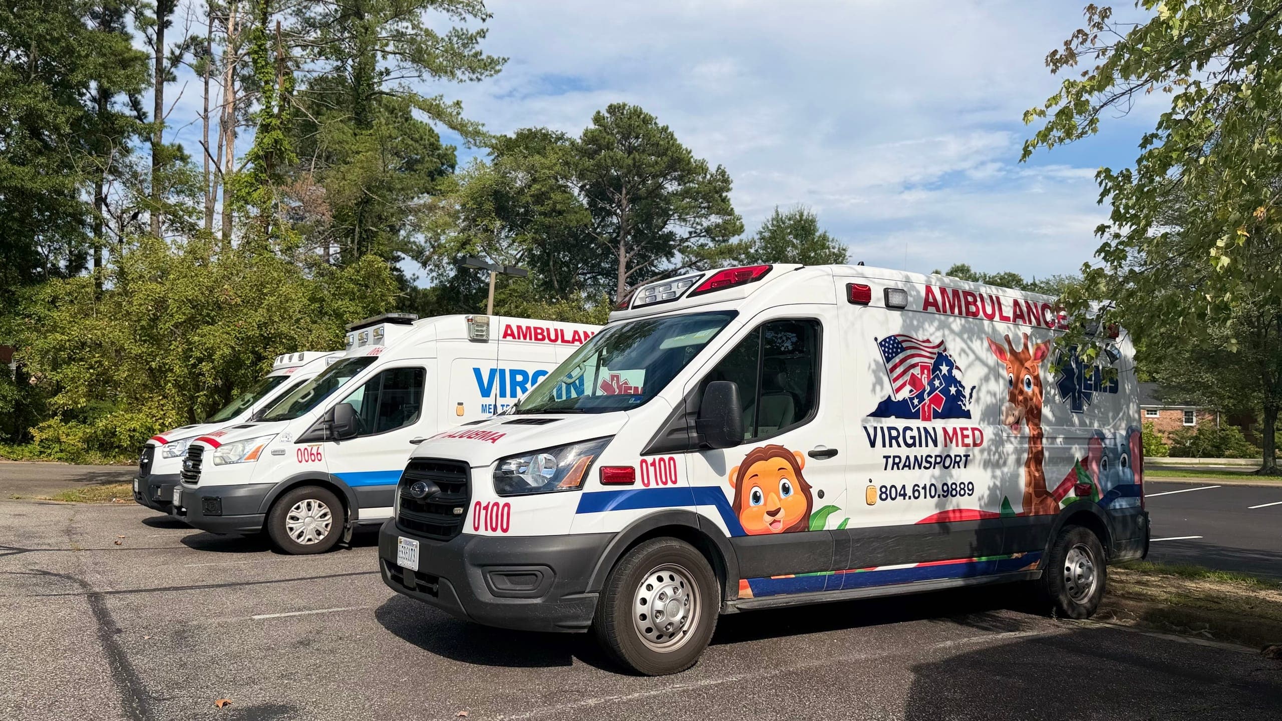 Virgin Med ambulance in the fleet lot, livery and dispatch number on the side