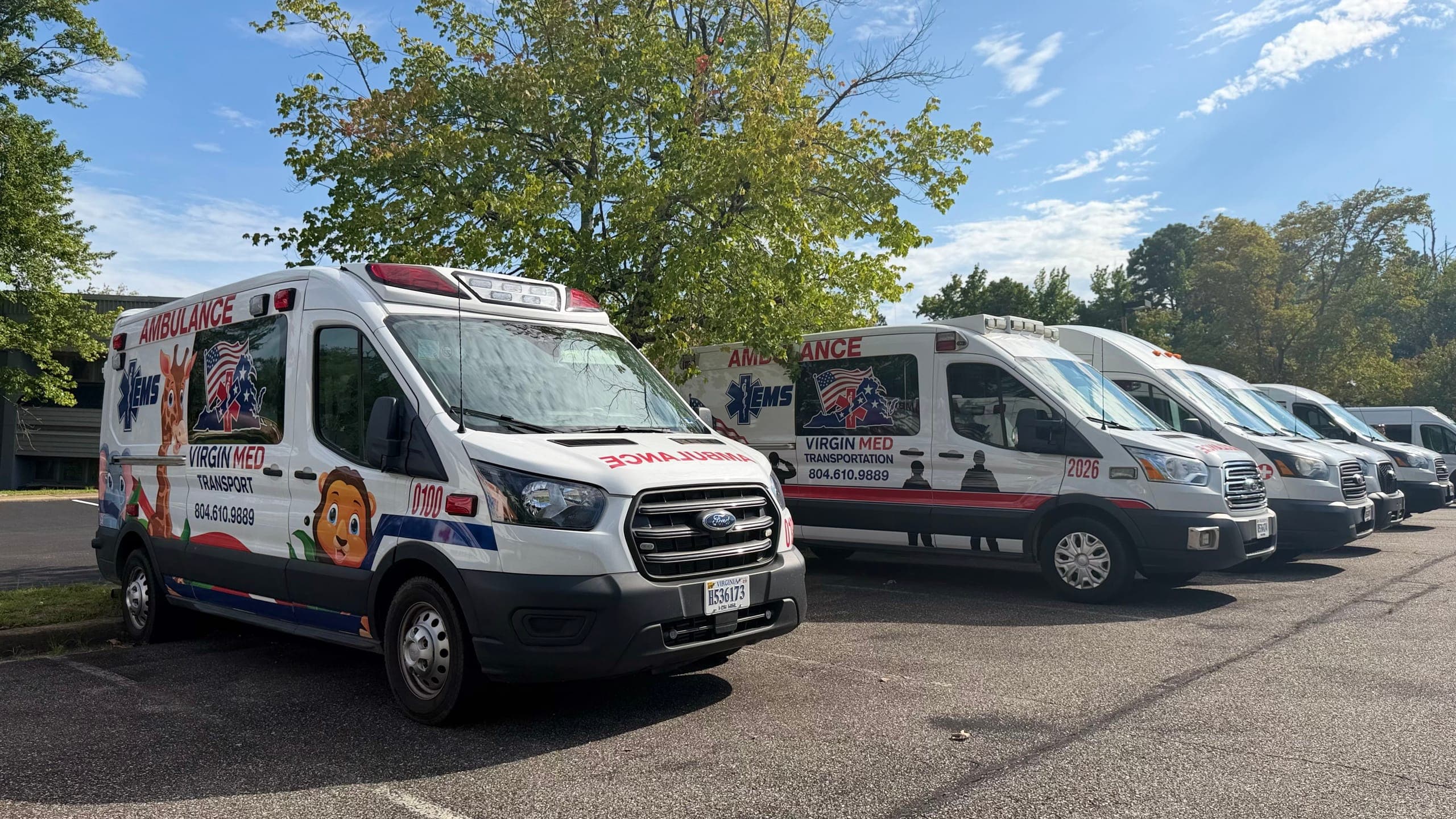 Virgin Med ambulances lined up in the lot