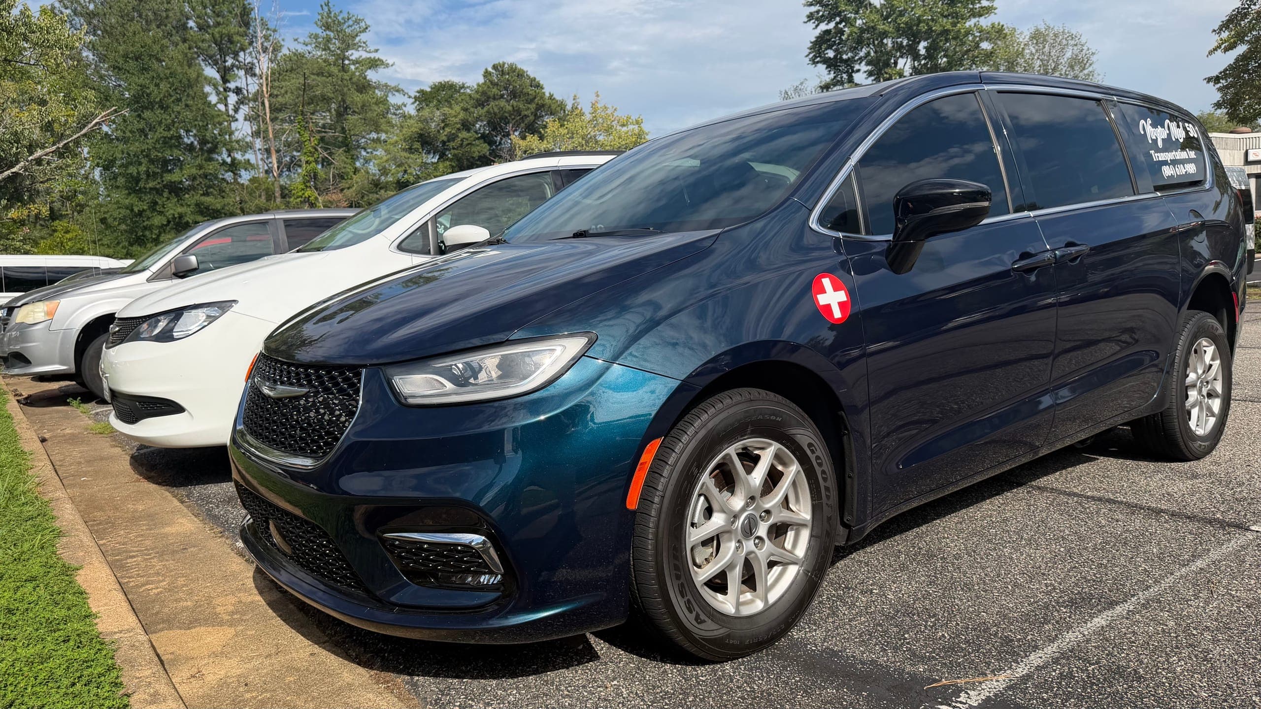 Dark blue Virgin Med minivan